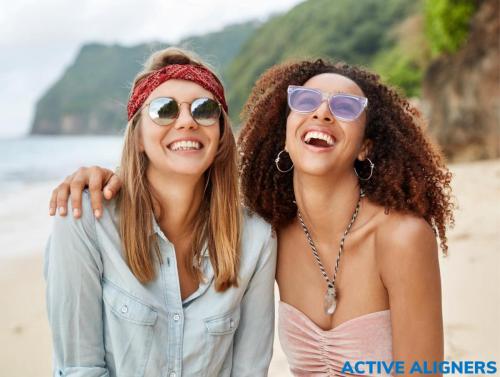 People wearing Active Aligners and smiling confidently